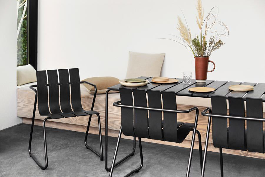 Ocean Table by Mater, showing ocean table with chairs in live shot.