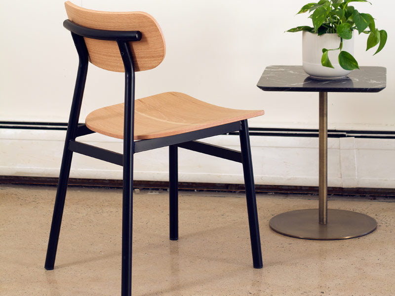 Ojai Chair by Kollektiff, showing of ojai chair with table in live shot.