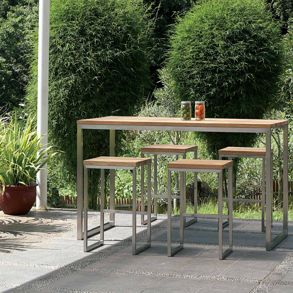 Oko Bar High Dining Table by Mamagreen, showing oko bar high dining table with high stools in live shot.