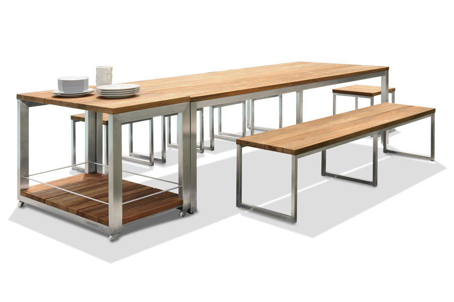Oko Dining Table by Mamagreen, showing oko dining table with dining benche, stools & trolley in teak/hairline original stainless steel.
