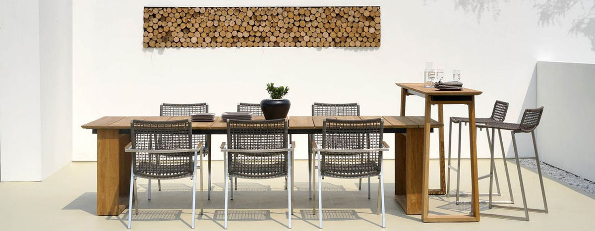 Olaf High Chair by Mamagreen, showing olaf high chairs with dining table, chairs & high table in live shot.