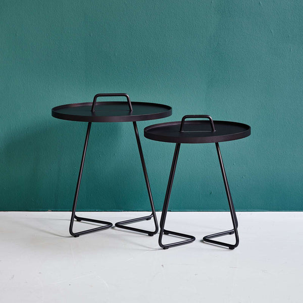 On The Move Side Table by Cane-Line, showing on the move side tables in live shot.
