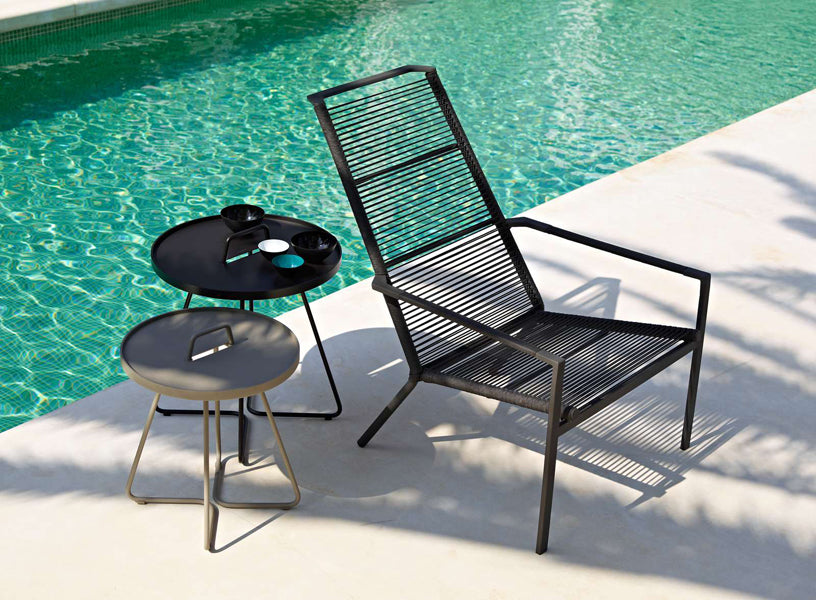 On The Move Side Table by Cane-Line, showing on the move side tables in live shot.