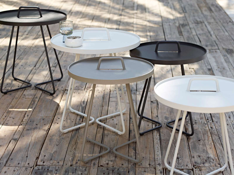 On The Move Side Table by Cane-Line, showing on the move side tables in live shot.