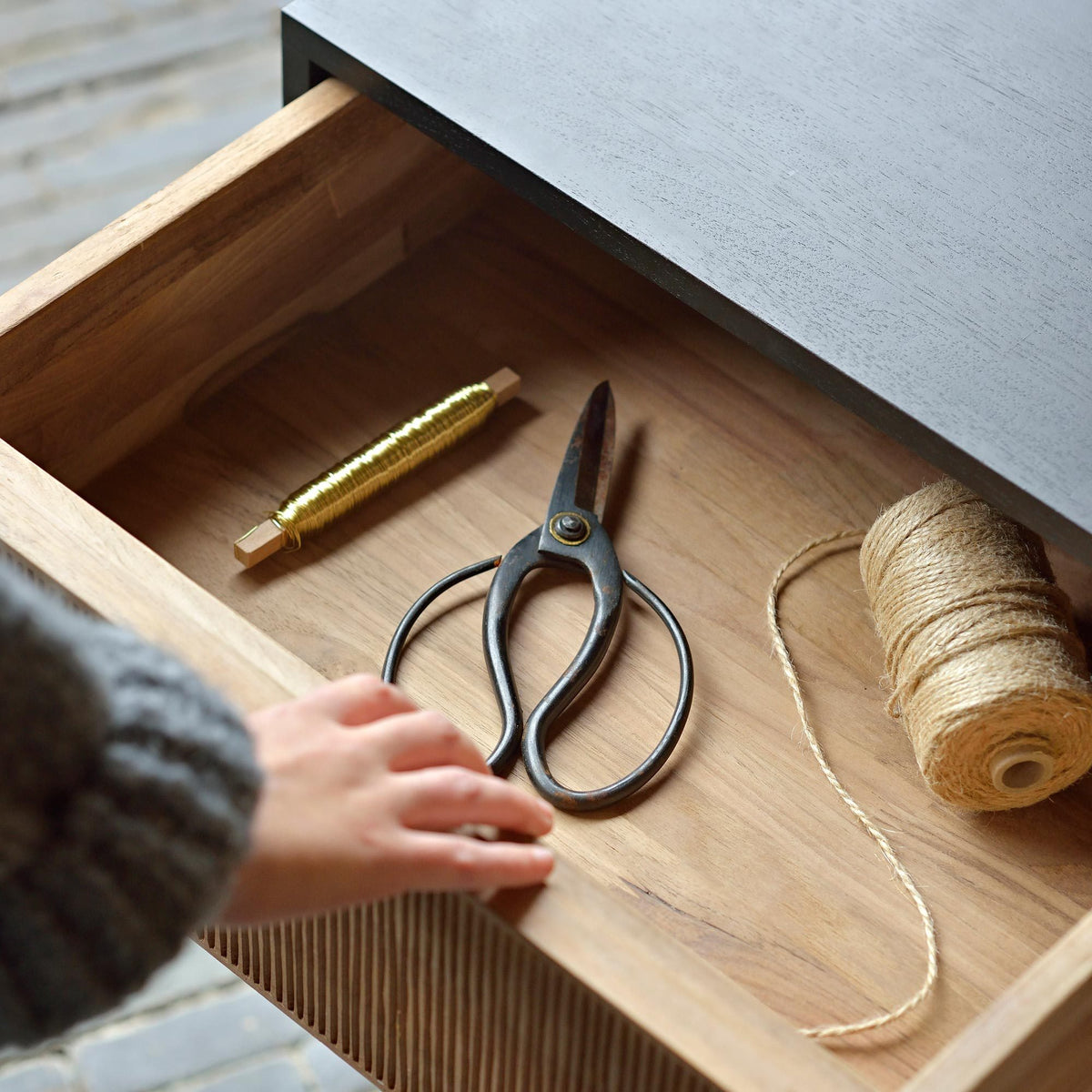 Oscar Drawer Unit by Ethnicraft, showing closeup view of teak drawer unit drawer in live shot.