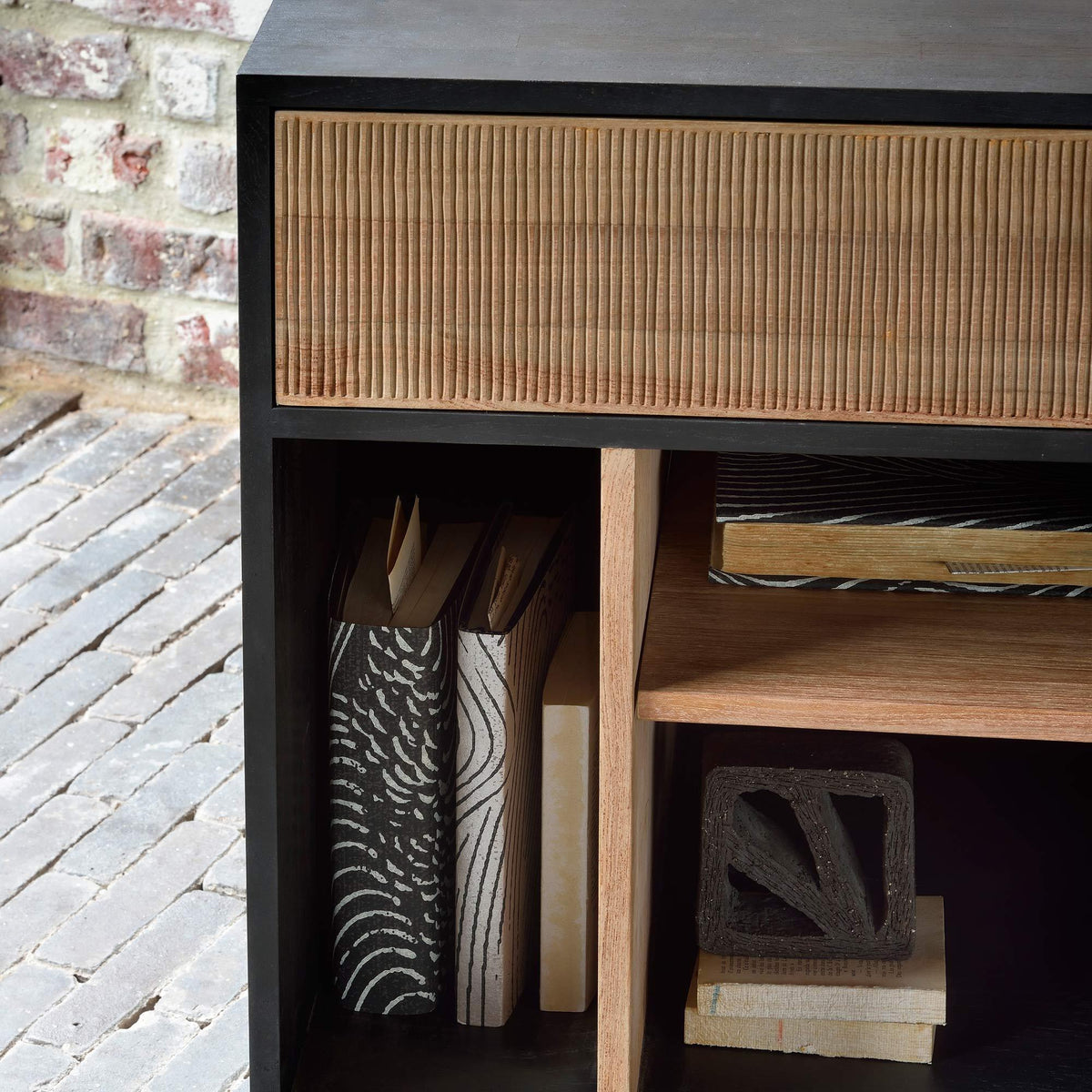 Oscar Drawer Unit by Ethnicraft, showing closeup view of teak drawer unit drawer in live shot.