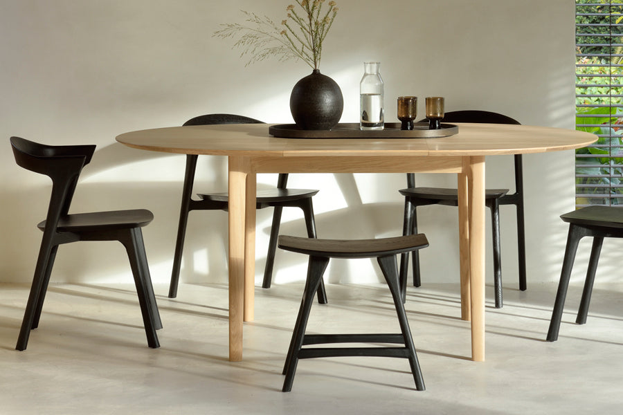 Osso Dining Stool by Ethnicraft, showing osso dining stool with chairs & table in live shot.