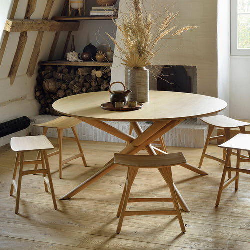 Osso Oak Contract Grade Dining Stool by Ethnicraft, showing oak contract grade dining stool with table in live shot.
