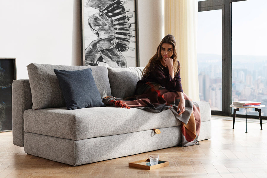 Osvald Sofa Bed by Innovation, showing osvald sofa bed with table in live shot.