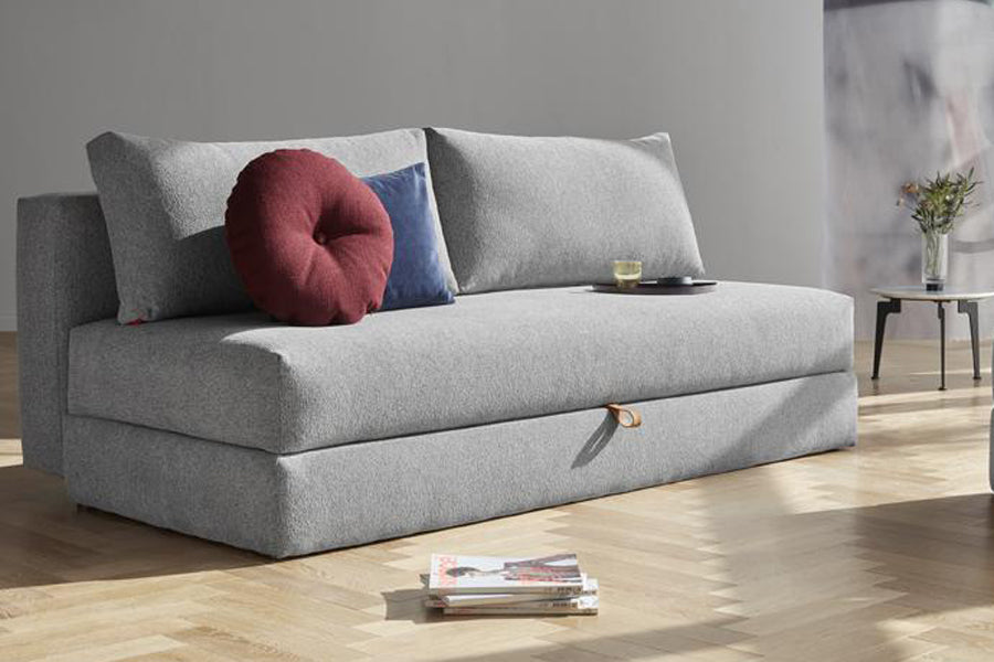 Osvald Sofa Bed by Innovation, showing osvald sofa bed with table in live shot.