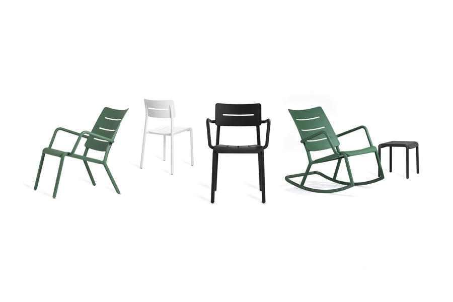 Outo Rocking Chair by Toou, showing angle view of outo rocking chair in dark green with outo different chairs.