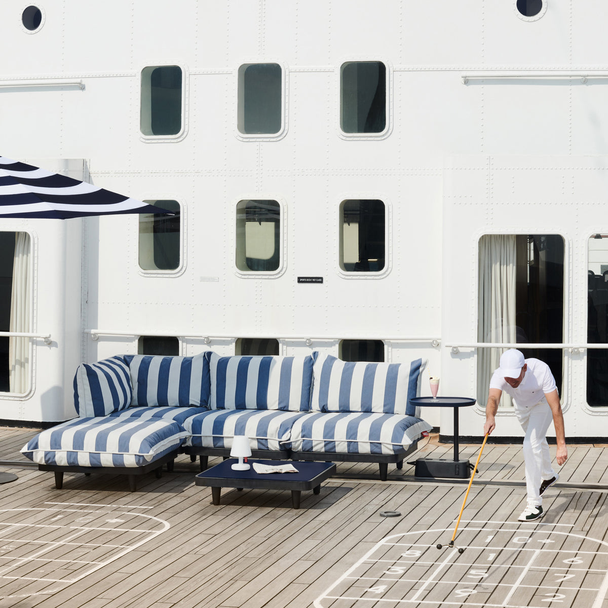 Paletti Outdoor Coffee Table by Fatboy, showing paletti outdoor coffee table in live shot.