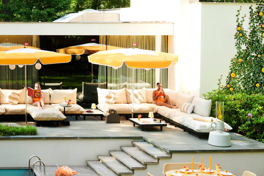 Paletti Outdoor Coffee Table by Fatboy, showing paletti outdoor coffee tables in live shot.