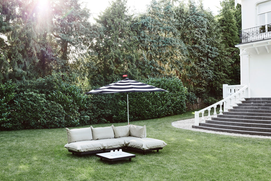 Paletti Outdoor Coffee Table by Fatboy, showing paletti outdoor coffee table in live shot.