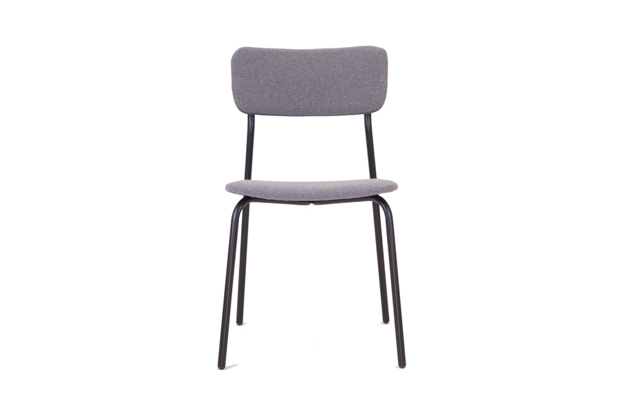 Paloma Dining Chair by Kollektiff, showing front view of paloma dining chair in gray fabric upholstered seat & backrest + black metal frame.