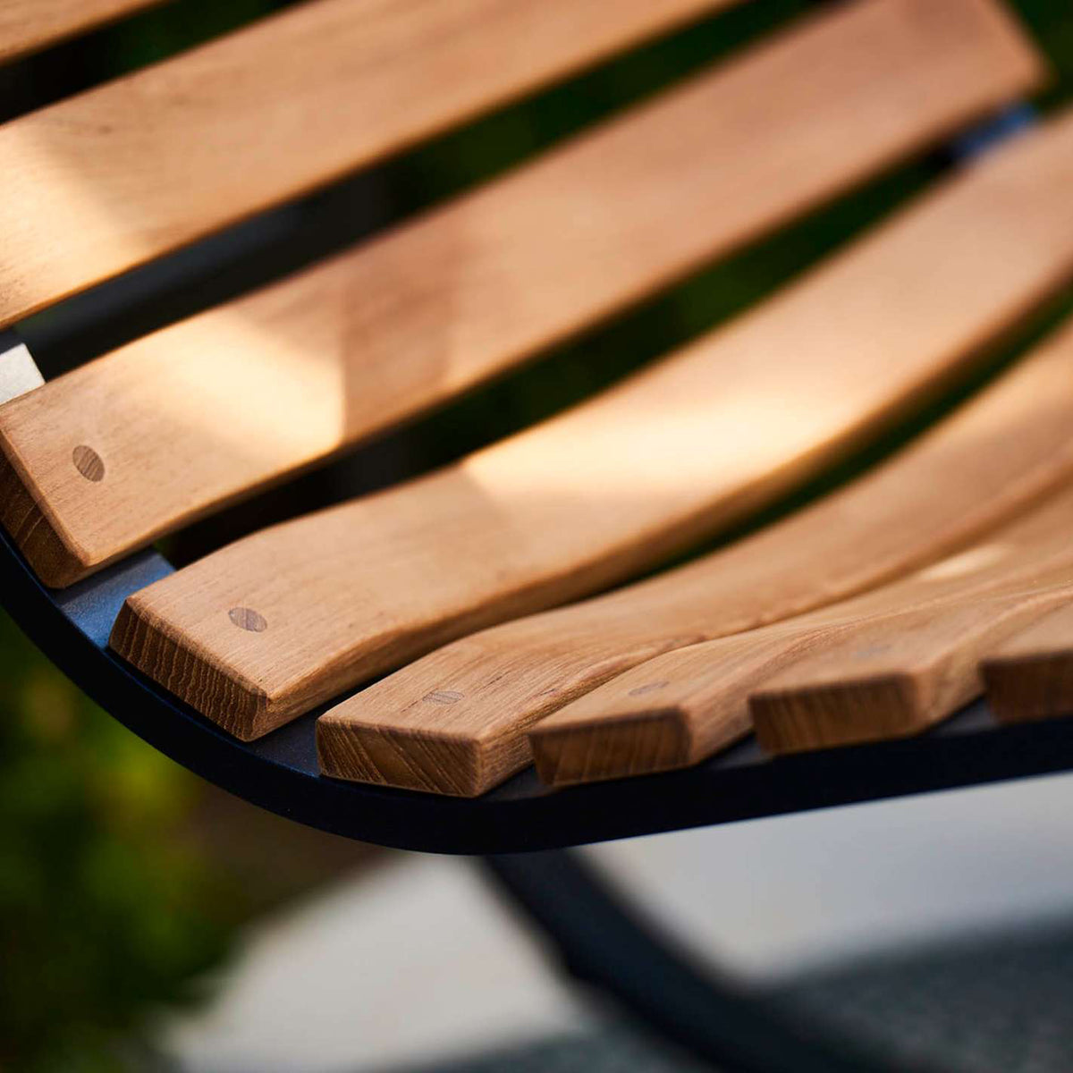 Parc Rocking Chair by Cane-Line, showing closeup view of parc rocking chair in live shot.