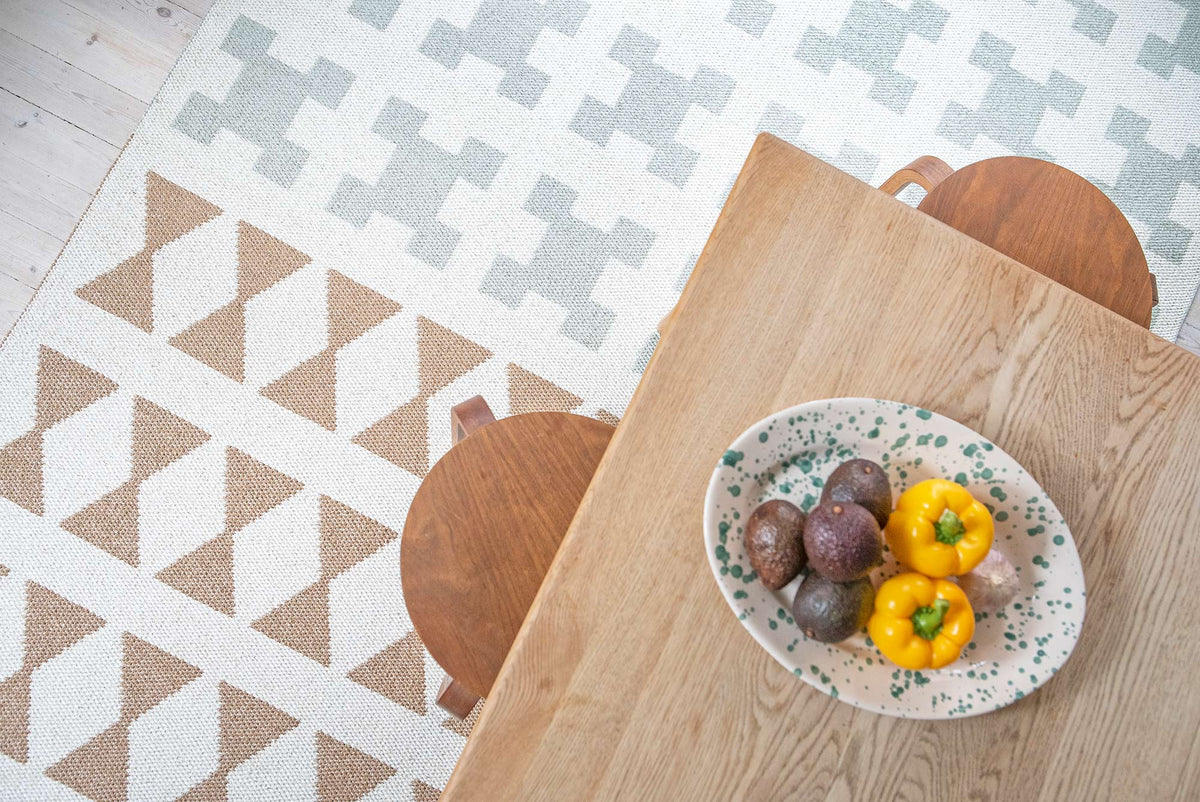 Paris Woven Plastic Rug by Brita, showing closeup view of paris woven plastic rug in live shot.
