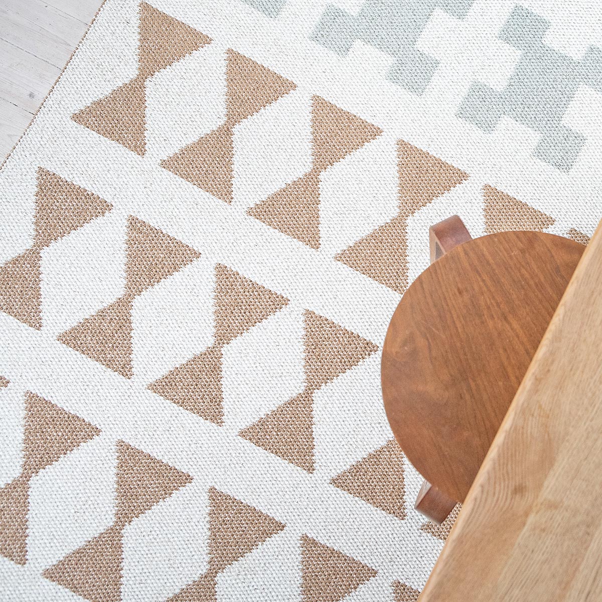 Paris Woven Plastic Rug by Brita, showing closeup view of paris woven plastic rug in live shot.