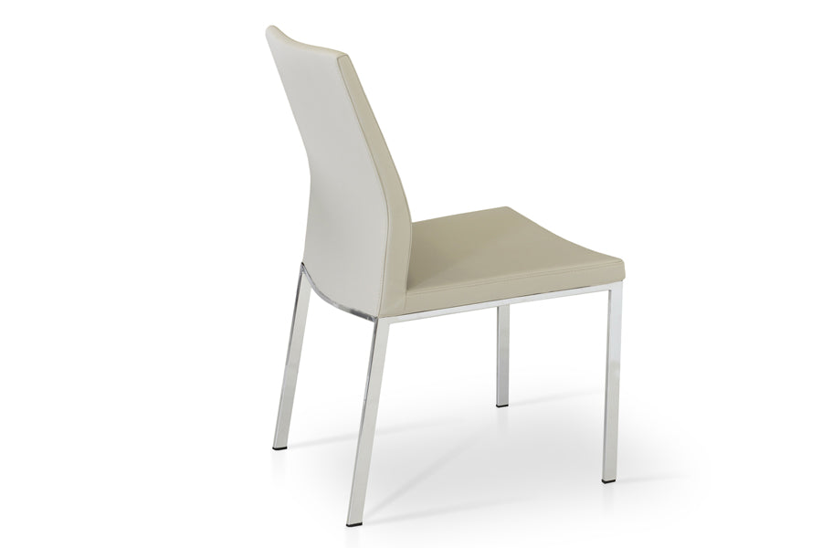Pasha Metal Dining Chair by SohoConcept, showing angle view of metal dining chair.