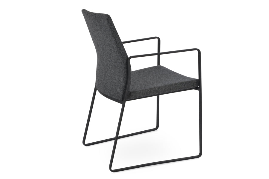 Pasha Arm Sled Dining Chair by SohoConcept. showing angle view of slide dining arm chair.