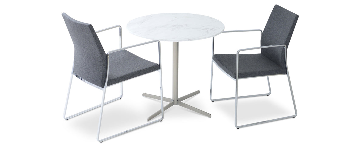 Pasha Arm Sled Dining Chair by SohoConcept, showing two slide dining arm chairs with table.