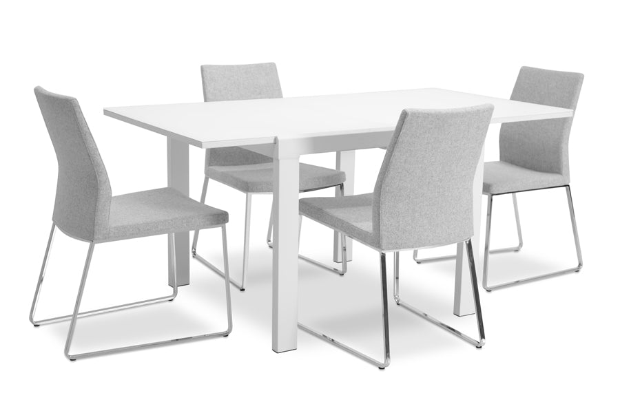 Pasha Sled Dining Chair by sohoConcept, showing sled dining chairs with table.
