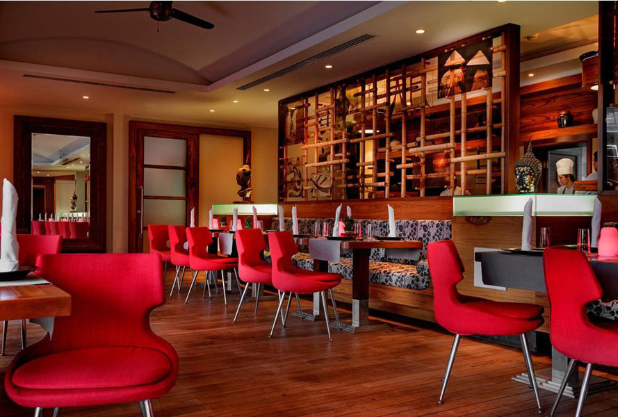 Patara Metal Dining Chair by SohoConcept, showing metal dining chairs with table in live shot.