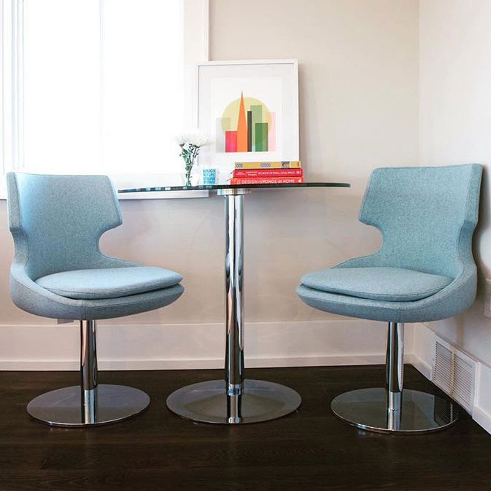 Patara Round Swivel Chair by SohoConcept, showing round swivel chairs with table in live shot.