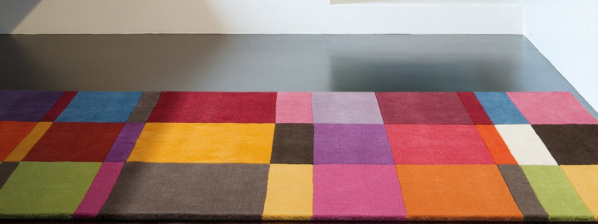 Patch 181.003.990 Hand Tufted Rug by Ligne Pure, showing closeup view of patch hand tufted rug in live shot.