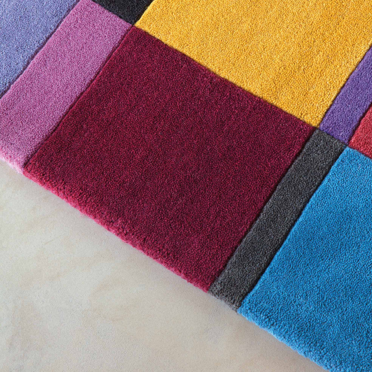 Patch 181.003.990 Hand Tufted Rug by Ligne Pure, showing closeup view of patch hand tufted rug.