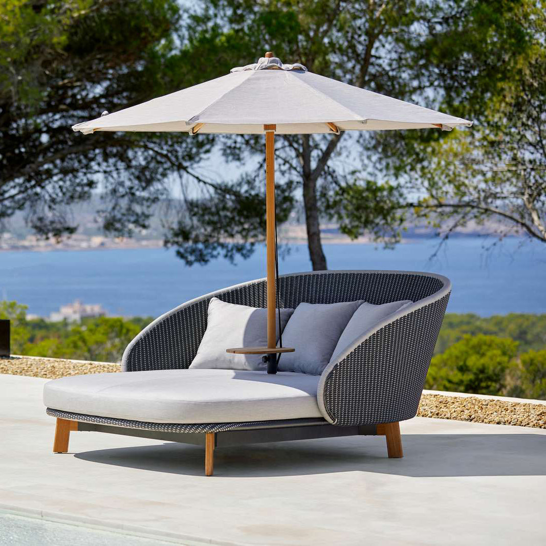Peacock Daybed by Cane-Line, showing peacock daybed in live shot.