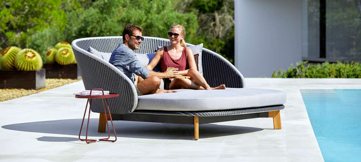 Peacock Daybed by Cane-Line, showing peacock daybed in live shot.