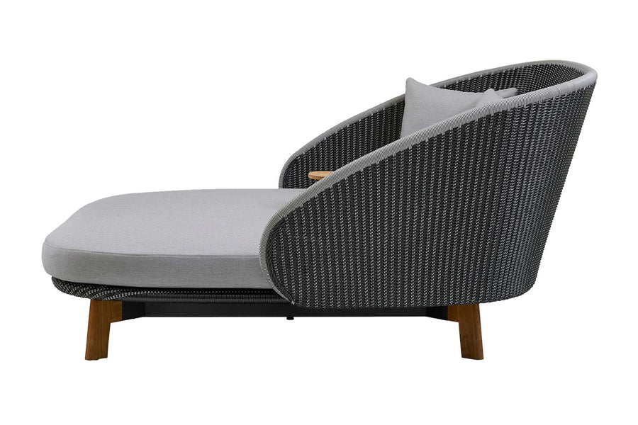 Peacock Daybed by Cane-Line, showing side view of peacock daybed in grey/light grey weave.