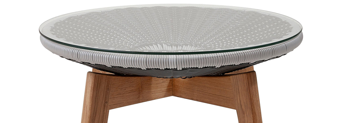 Peacock Footstool/Side Table by Cane-Line, showing top view of peacock footstool/side table in grey/light grey, clear safety glass.