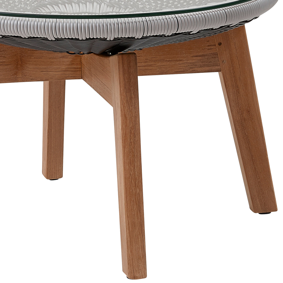 Peacock Footstool/Side Table by Cane-Line, showing closeup view of peacock footstool/side table in grey/light grey, clear safety glass.