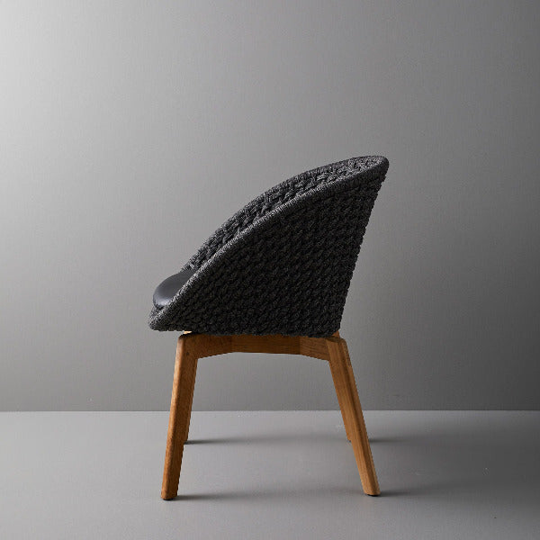 Peacock Indoor Dining Chair by Cane-Line, showing peacock indoor dining chair in live shot.
