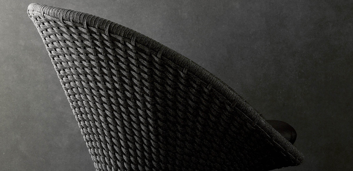 Peacock Indoor Lounge Chair by Cane-Line, showing closeup view of peacock indoor lounge chair in live shot.