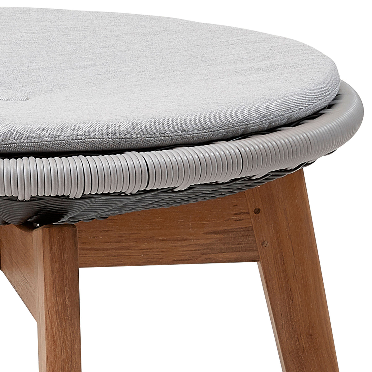 Peacock Upholstery Footstool by Cane-Line, showing closeup view of peacock upholstery footstool in grey/light grey, light grey natte cushion w/quickdry & airflow system.