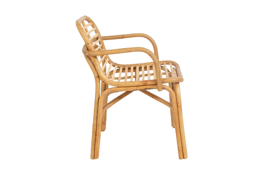Peak Rattan Dining Armchair by Cane-Line, showing side view of peak rattan dining armchair in natural rattan.