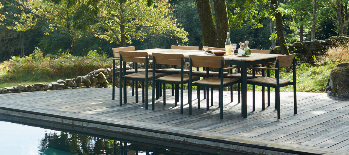 Pelago Armchair by Skagerak, showing pelago armchairs in live shot.
