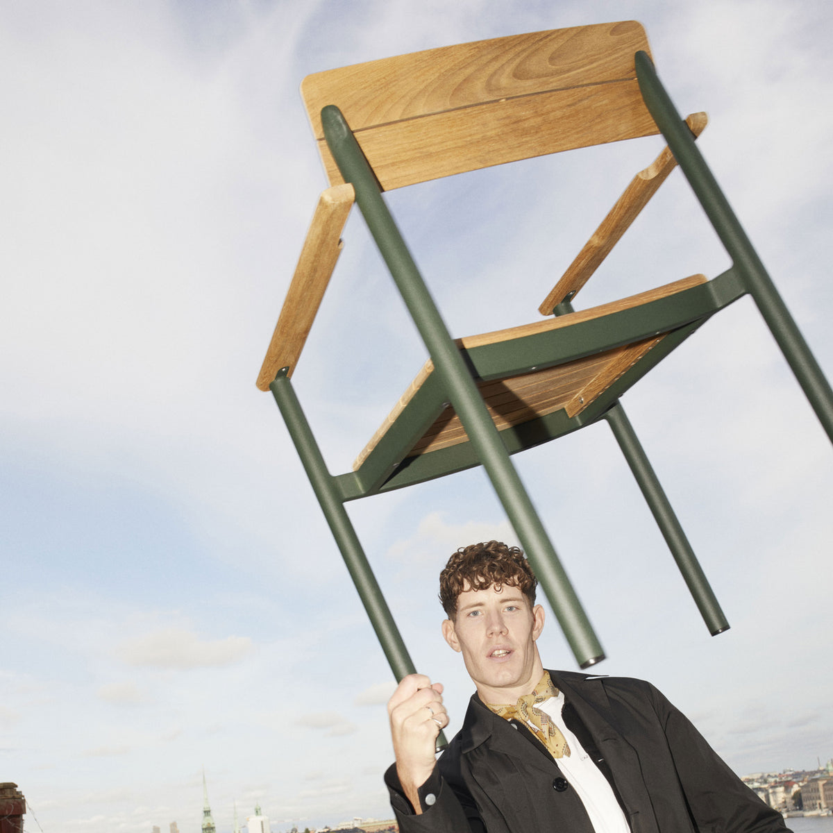 Pelago Armchair by Skagerak, showing pelago armchair in live shot.
