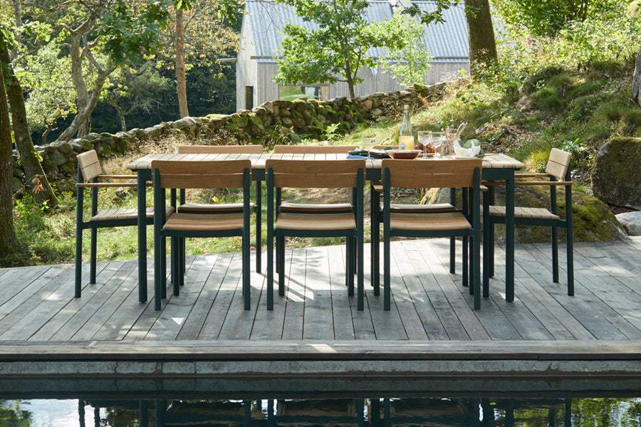 Pelago Armchair by Skagerak, showing pelago armchairs in live shot.