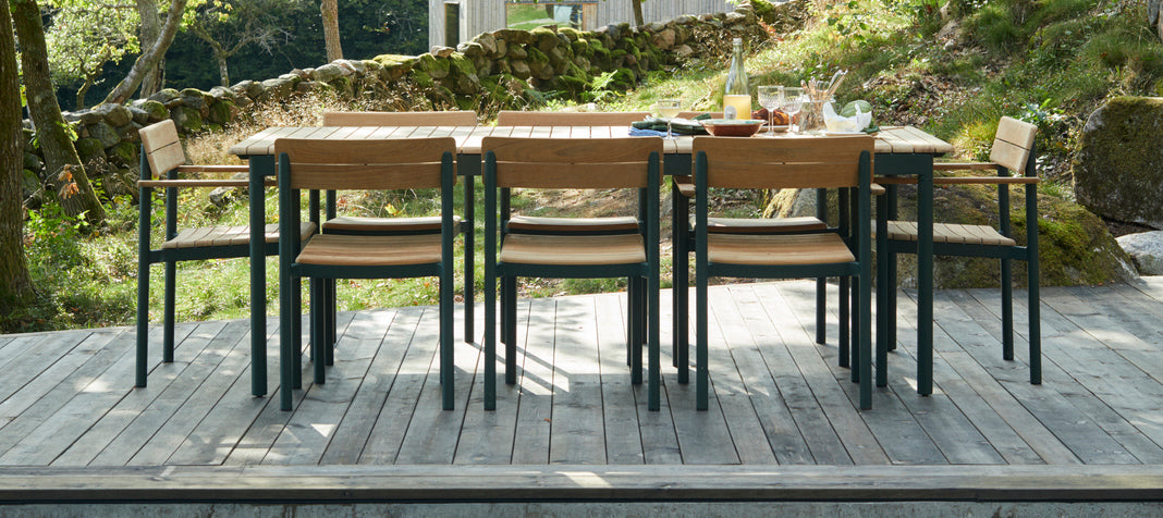 Pelago Armless Chair by Skagerak, showing pelago armless chairs in live shot.