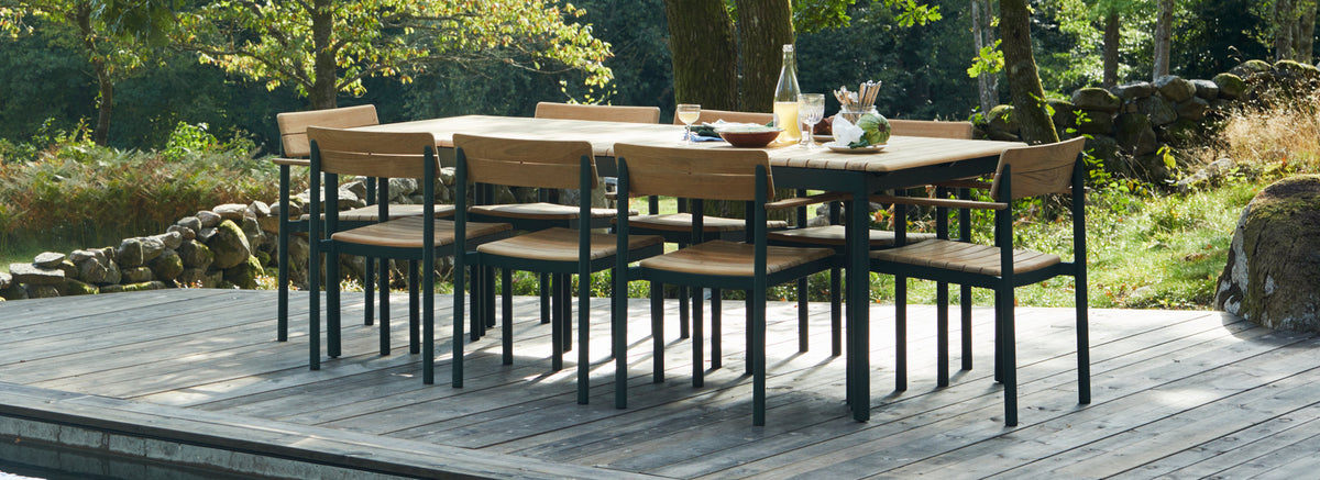 Pelago Dining Table by Skagerak, showing pelago dining table with chairs in live shot.