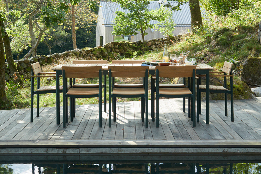 Pelago Dining Table by Skagerak, showing pelago dining table with chairs in live shot.