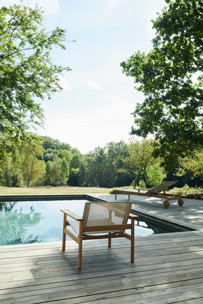 Pelago Lounge Chair by Skagerak, showing pelago lounge chair in live shot.