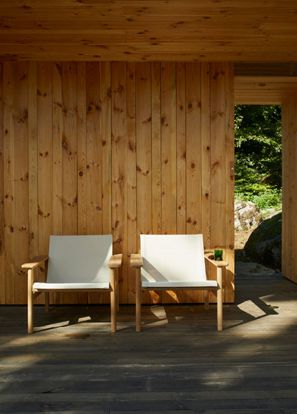 Pelago Lounge Chair by Skagerak, showing pelago lounge chairs in live shot.