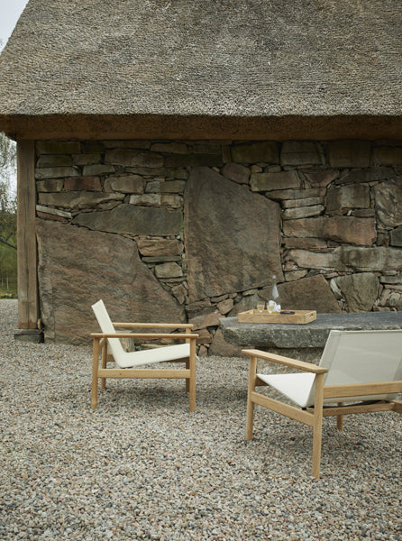 Pelagus Oudoor Lounge Chair by Skagerak, showing pelagus oudoor lounge chair in live shot.