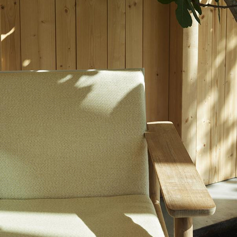 Pelagus Oudoor Lounge Chair by Skagerak, showing closeup view of pelagus oudoor lounge chair in live shot.
