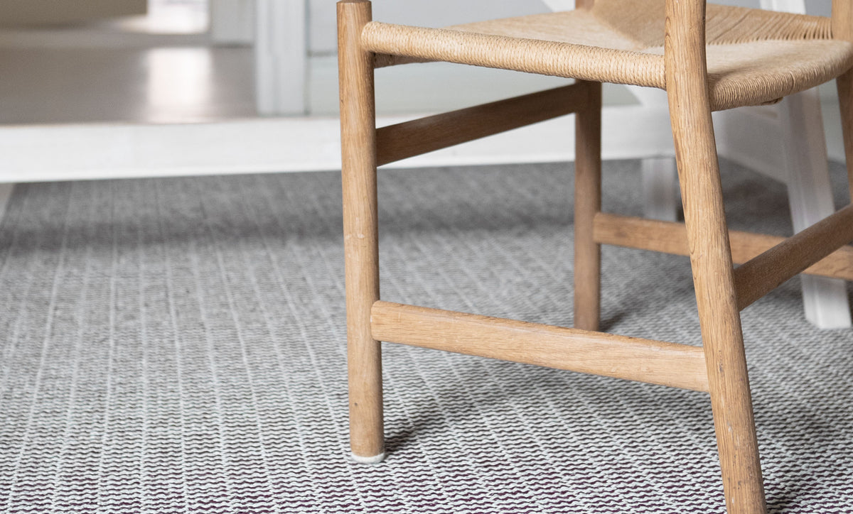 Pemba Woven Plastic Rug by Brita, showing closeup view of pemba woven plastic rug in live shot.